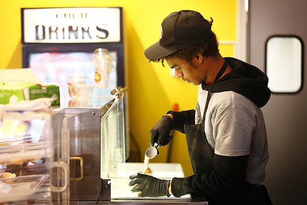 staff member working behind the counter