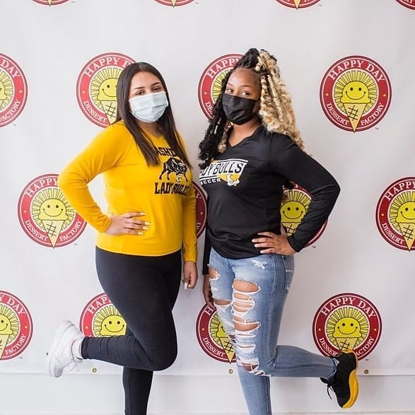 Two Female Staff posing
